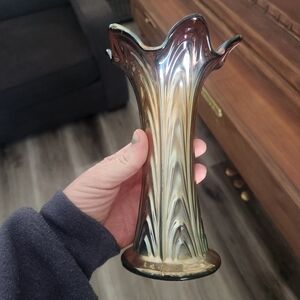 vintage Fenton carnival glass ribbed swung vase with an iridescent finish.